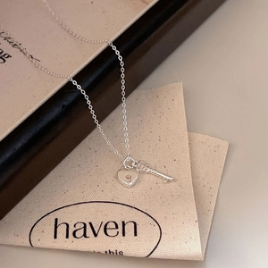 Minimalist 925 sterling silver necklace featuring a romantic heart lock and key pendant set