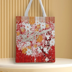 Detail of red Christmas canvas tote bag with Santa Claus prints and Merry Christmas text
