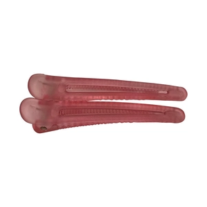 Set of two pink matte translucent flat hair clips for volume and styling on white background