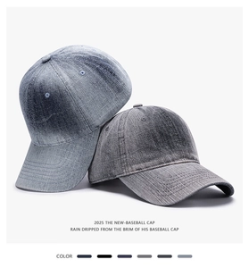 Close-up of vintage washed denim baseball caps in blue and grey with stitched eyelets
