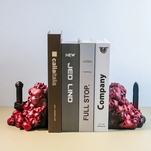 Gothic skull bookends set with dragon slayer sword design in red and black resin finish