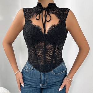 Detail of black lace corset top with sheer mesh, boning structure, and neck tie design