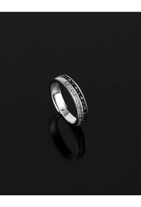 Macro shot of silver ring with star pattern and SHINE VACATION engraving detail