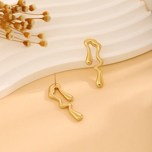 Modern gold irregular wave drop earrings with polished metallic fluid style and mirror finish
