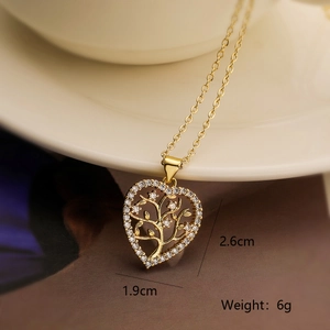 Macro shot of heart pendant with tree of life design and zircon, size 2.6x1.9cm, 6g