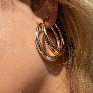 Minimalistische dicke Creolen in Gold und Silber mit polierter Oberfläche für Damen
