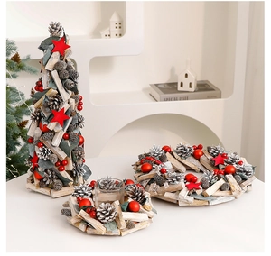 Close-up of rustic Christmas decor with wood, pine cones, red berries and glass candle holder