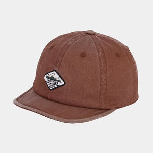 Macro view of vintage brown washed cotton baseball cap with mountain embroidery