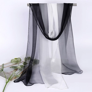 Close-up of lightweight chiffon scarf with elegant black grey and white gradient tones