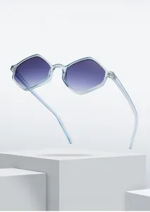 Detail of light blue hexagonal sunglasses with purple gradient lenses on stone