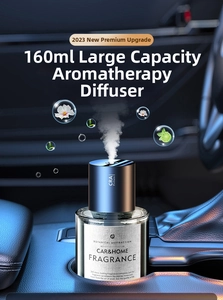 Detail of 160ml smart car mist diffuser in premium dark blue placed in a car cup holder