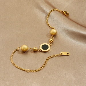 Gold plated stainless steel chain bracelet with Roman numeral disk and golden beads