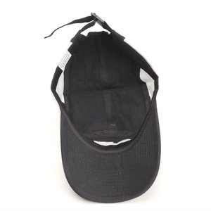 Close-up of internal labels and adjustable strap on a quick-dry polyester baseball cap
