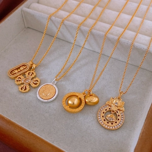 Detail of four neo-Chinese pendant necklaces with lotus and safety lock charms