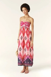 Detail of pink halter neck maxi dress with vibrant tribal geometric print and border pattern