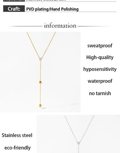 Detail of PVD gold and silver stainless steel long pendant necklace with zircon stone