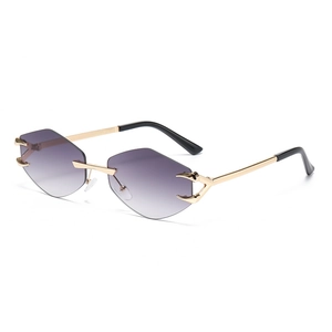 Frameless polygonal sunglasses with purple gradient lenses and gold devil claw accents