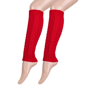 Detailed view of bright red cable knit leg warmers with thick textured woven pattern