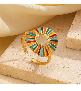 Macro shot of gold stainless steel ring with colorful rainbow enamel radial patterns