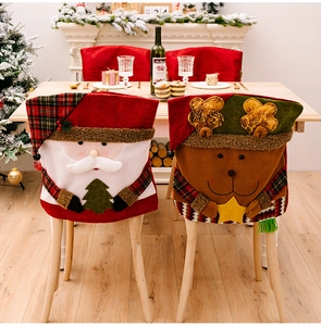 Macro view of Santa and Reindeer chair covers featuring festive 3D embroidery details