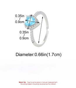 Detail view of heart-shaped blue zircon ring with copper band dimensions and 2.3g weight