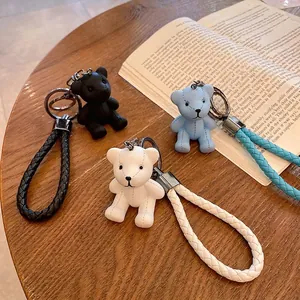 Cute resin bear keychains in black white and blue with stylish braided leather straps