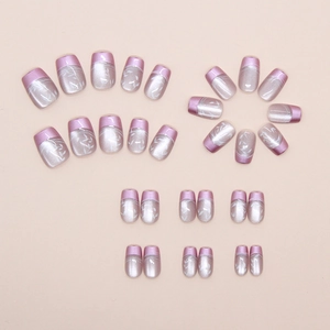 Detail of purple French leaf press-on nails with metallic finish and white patterns