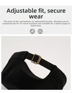 Detail of adjustable metal buckle and bronze slide closure on a black canvas cap