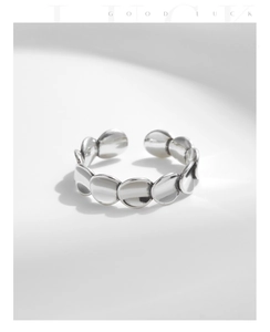 Detailed top view of 925 silver irregular fish scale disc ring with adjustable opening