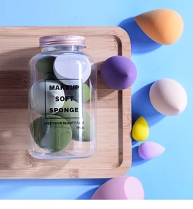 Macro shot of 7pcs colorful makeup sponges set in a clear jar with rose gold lid