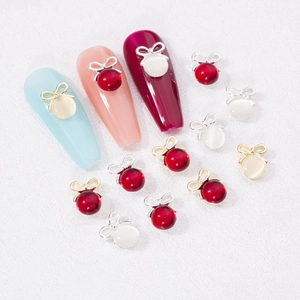 Bijoux d'ongles élégants en forme de nœud avec perles œil-de-chat rouges et blanches