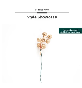 Detailed view of a 7-pronged glitter gold berry stem for festive Christmas DIY crafts