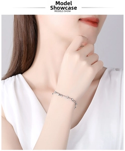 Close-up of double-layer 925 silver star bracelet worn on a female wrist for daily wear