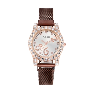 Close-up of Amadi rose gold watch featuring a rhinestone bezel and mesh Milanese strap