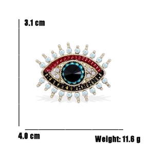 Detail view of Evil Eye brooch with turquoise enamel and crystals showing 3.1x4cm dimensions