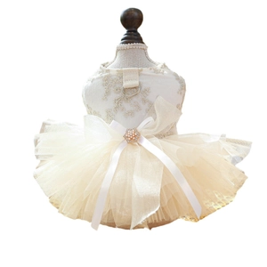 Elegant cream pet wedding dress with lace embroidery, pearls, and bow for small dogs