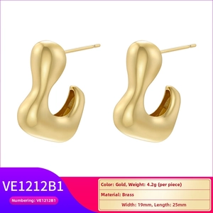 Detailed specs of gold organic fluid earrings in brass with satin finish and size info