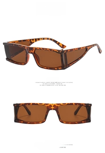 Detail view of square leopard print sunglasses with dark brown lenses on white background