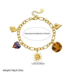 Gold stainless steel bracelet featuring leopard heart and sun pendants on white background