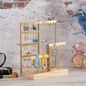 Golden metal jewelry organizer with wooden base for earrings, necklaces and bracelets