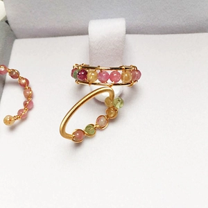 Detail of 14K gold filled wire wrapped rings with colorful tourmaline crystal beads