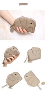 Macro detail of elephant-shaped gray leather coin purse with metal zipper and wrist strap