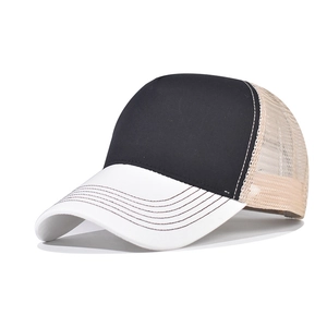 Three-tone mesh trucker hat with black front, white brim, and beige breathable rear