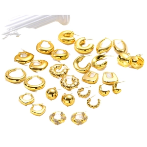 Minimalist gold geometric C-shaped earrings with smooth and braided texture details
