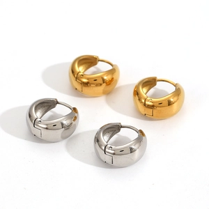 Polished thick gold and silver stainless steel huggie earrings in a minimalist style