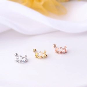 Three half-hoop earrings in gold, silver, and rose gold with opals and colored zircons