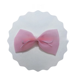 Detailed view of handmade pink mesh bow hair accessory for plush toys and children clips