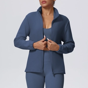 Detail of fleece texture and zip-up high collar on a blue women sports jacket
