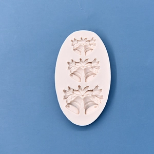 Silicone Christmas bell mold with holly leaf patterns for DIY cake baking and crafts