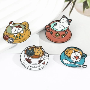 Macro view of four cute cat and rabbit enamel pins in colorful coffee cup designs